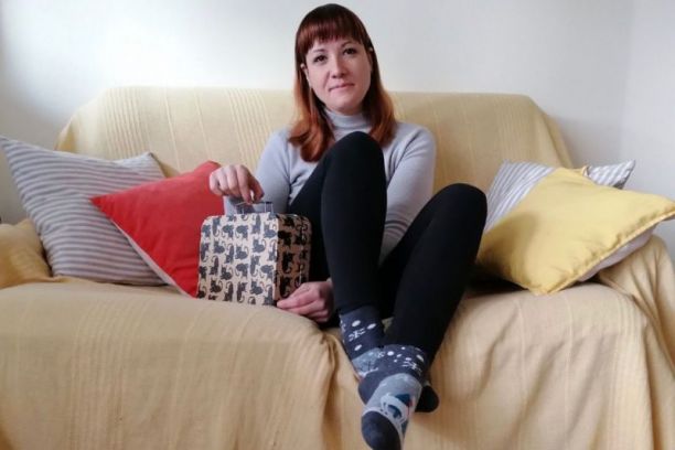 Milena with a Memory Suitcase on her European couch | Photo: private